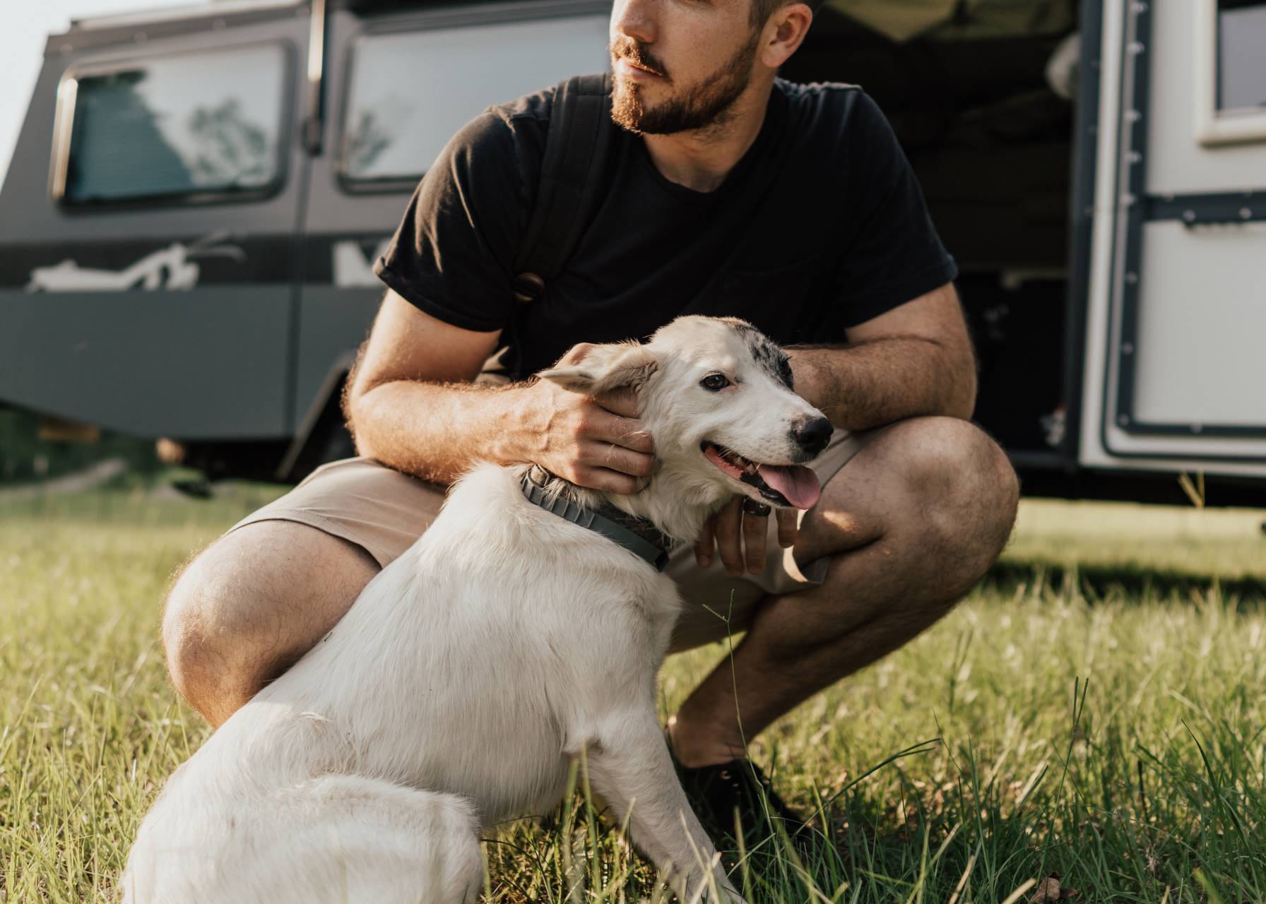 man with dog in front of TAXA Mantis